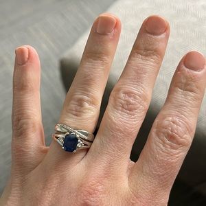 This is a size 5.5 sapphire ring with diamonds and a 14k white gold band.